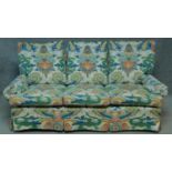 A two seater sofa in polychrome Chinese style upholstery. H.85 W.175 D.100cm