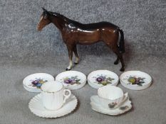 A collection of porcelain. Including a Beswick horse, Royal Worcester coasters with a floral