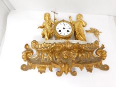 Parts of an antique French gilt bronze clock on a white alabaster base. It has a gilt ormolu bracket