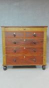 A Victorian mahogany chest of two short over three long drawers on turned bun feet. H.123 W.126 D.