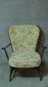 A vintage Ercol beech framed armchair with fauna & flora design fabric upholstered seat and back
