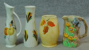 A collection of vintage hand painted Radford pottery pieces. One jug is Butterflyware with a moulded