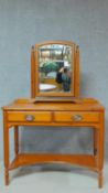 A Victorian style pitch pine dressing table with a matching swing mirror. H.143 W.98 D.49cm