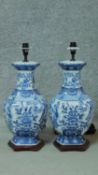 A pair of blue and white Oriental style vases converted to table lamps. Mounted on hexagonal