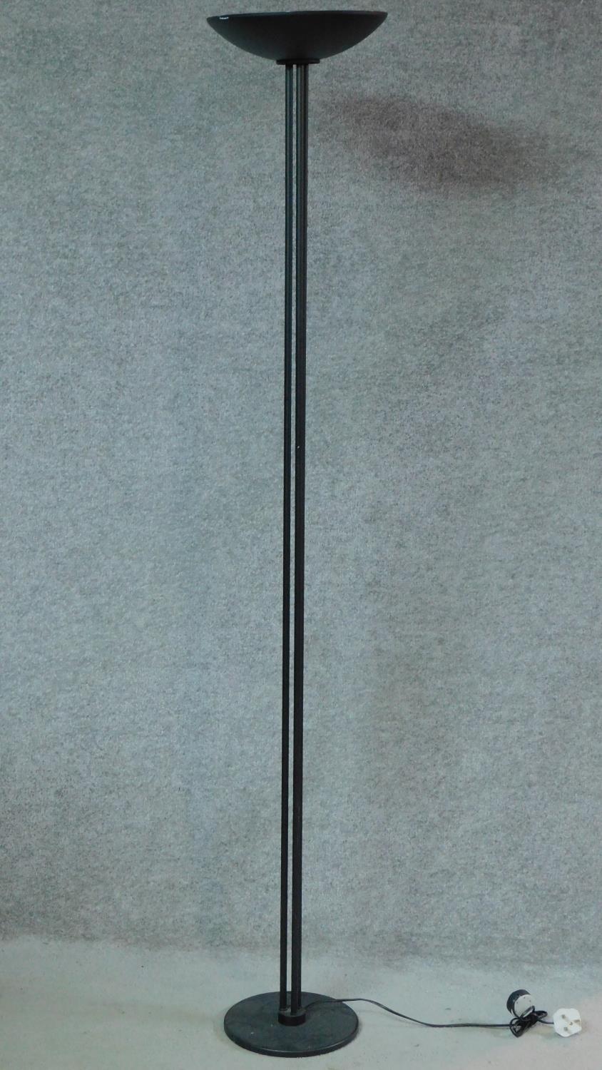 A contemporary black metal floor standing uplighter. H.178cm