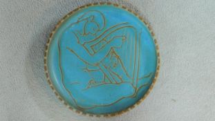 A mid century pale blue glazed studio pottery Sgraffito charger by London artist Lucy Rickards,