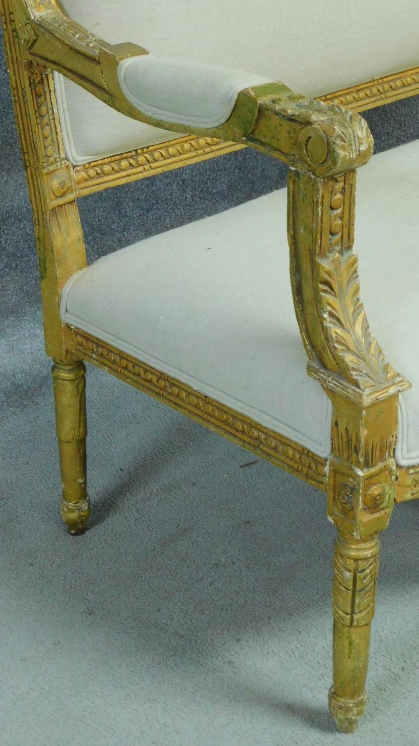 A Louis XVI style carved giltwood sofa with cream upholstery raised on turned tapering supports. H. - Image 4 of 10