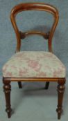 A Victorian mahogany balloon back dining chair on turned tapering supports. H.90cm