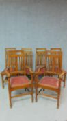 A set of six late 19th century oak Art's and Craft's dining chairs to include two armchairs. H.107cm