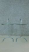 A pair of contemporary glass and tubular metal occasional tables. H.70cm