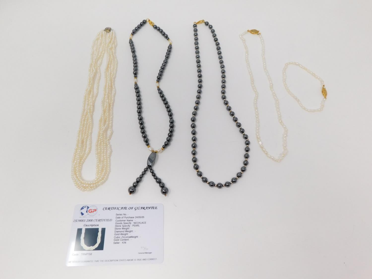 A collection of hematite and cultured pearl jewellery. Including two Hematite necklaces, one