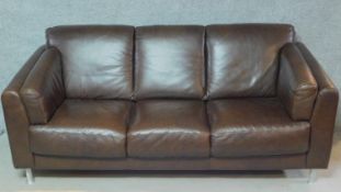 A contemporary three seater brown leather sofa. H.85 W.195 D.85cm