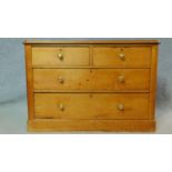 A Victorian pine chest of two short over two long drawers on plinth base. H.74 W.108 D.48cm