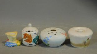 A collection of four vintage hand painted Radford Pottery pieces. Inlcuding two lidded pots, a