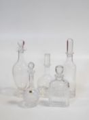 A collection of five crystal decanters. One Atlantis crystal with linear design and makers stamp,