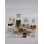 A collection of nine 19th century clear pharmacy/chemist jars and bottles, some with a gilt-bordered