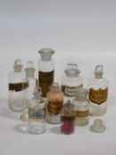 A collection of nine 19th century clear pharmacy/chemist jars and bottles, some with a gilt-bordered