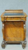 A Victorian burr walnut Davenport with fitted satinwood lined interior and four drawers opposing