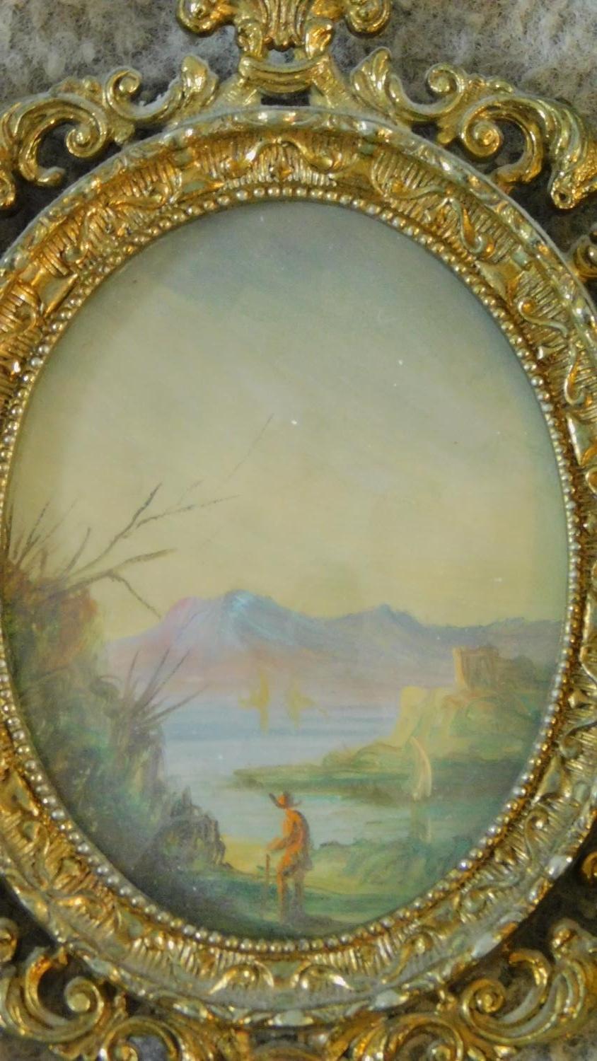 A pair of miniature prints, interior scenes and an oval landscape scene, all in decorative gilt - Image 4 of 5