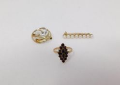 A 9 ct gold pearl bar brooch with a yellow metal garnet ring and a bi-colour 9ct gold pearl and