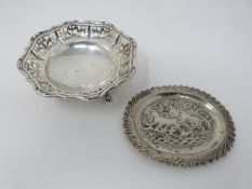 A silver pierced floral design Bon Bon dish on four hooved feet, hallmarked: BBS ltd for Barker