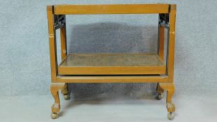 A mid century beech framed folding serving trolley. H.74 W.78 D.38cm