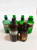 A collection of 19th century four green and two brown pharmacy jars and bottles some with a gilt-