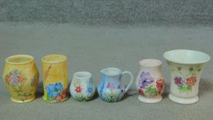 A collection of five vintage hand painted Radford Pottery vases and a jug. Two with yellow