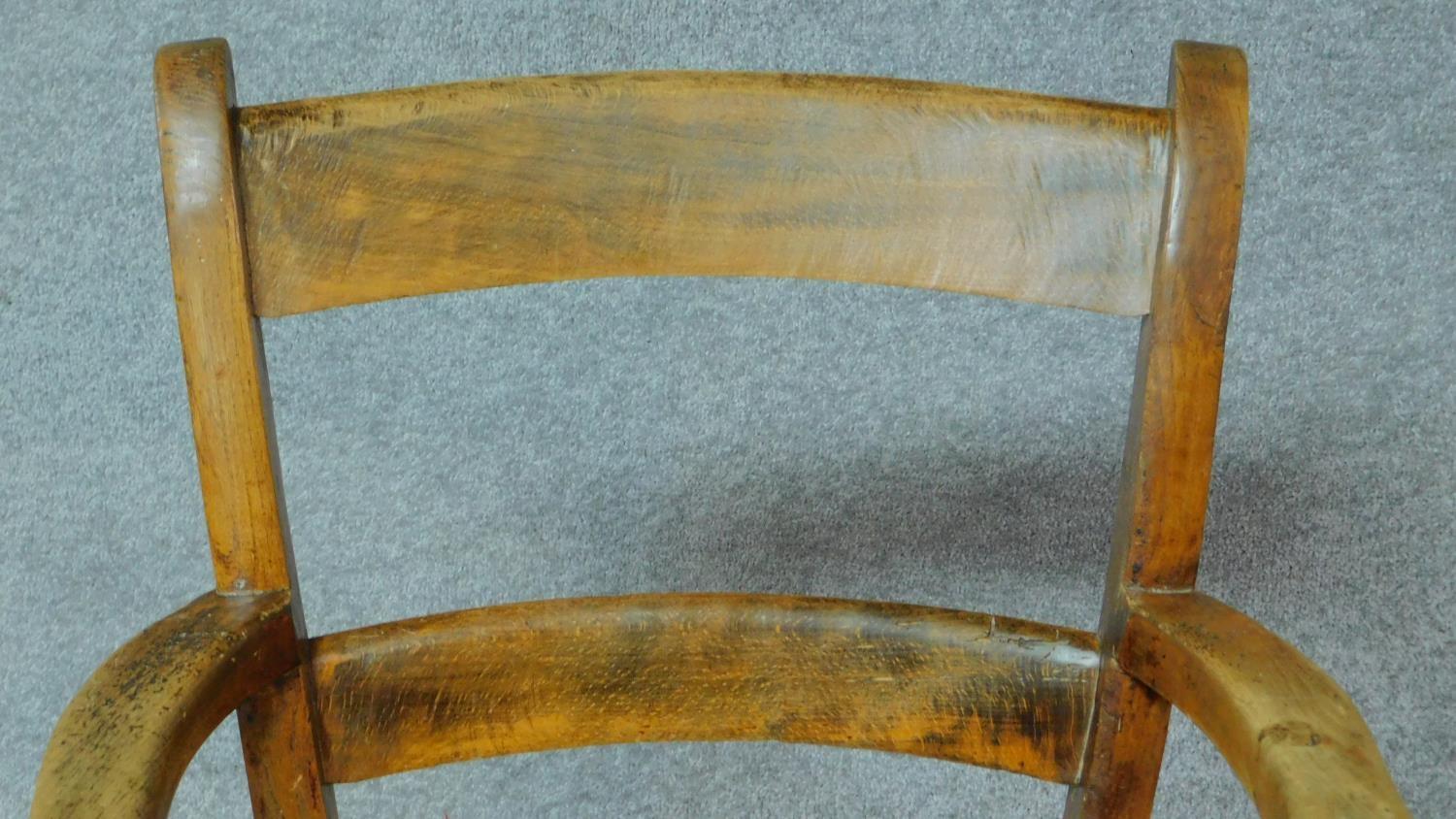 A 19th century country style open armchair with elm seat on turned stretchered supports. H.89cm - Image 3 of 4