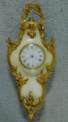 A gilt metal and marble miniature Cartel clock in the Rococo style with white enamel dial, Roman