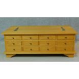 A contemporary bank of spice drawers with hinged lidded storage section. H.43 W.120 D.66cm