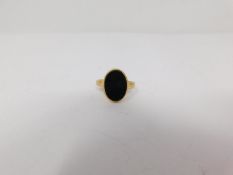 A vintage 18 carat yellow gold and bloodstone oval signet ring, hallmarked NBs for Nathan