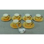 A hand painted Collingwood porcelain coffee set decorated with various butterflies along with a