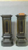 A pair of late 19th century stepped and facetted ebonised and gilt pedestal columns. H.130 W.49 D.