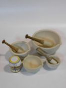 Four late 19th century pharmacist or apothecary's mortars & three pestles. The mortars are made