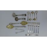 A pair of silver plated berry spoons and various other items of plated flatware. To include a pair