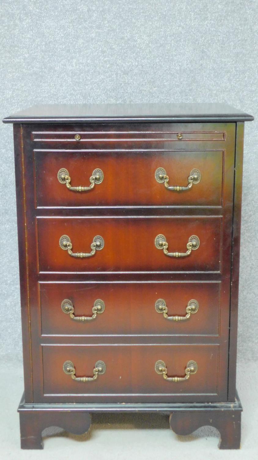 A Georgian style mahogany hi-fi cabinet with lift up top and panel door fitted with faux drawers