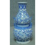 A Chinese blue and white double gourd shaped vase with twin carrying handles. H.49cm