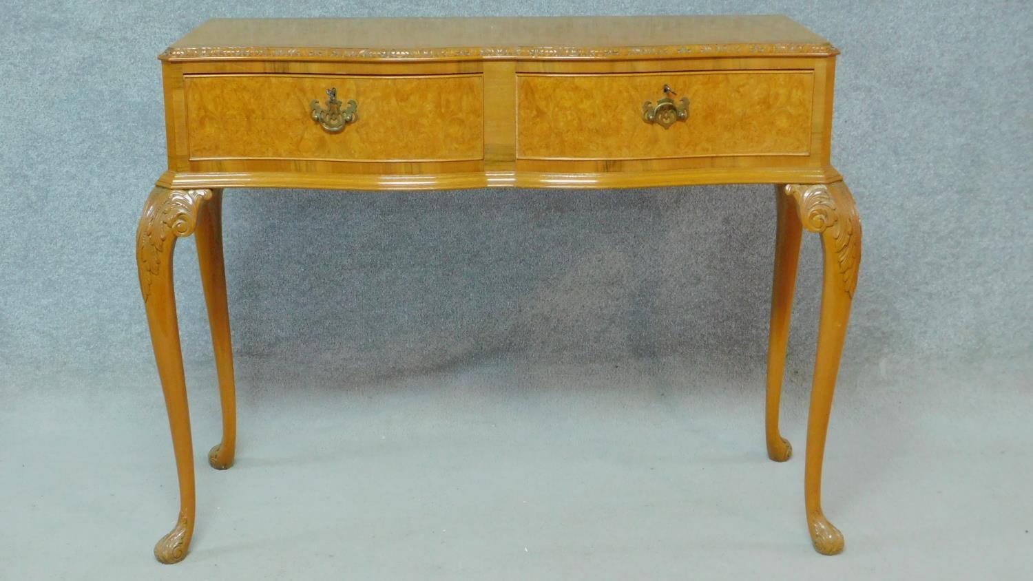 A mid century burr walnut Georgian style serving table with fitted canteen drawers containing a