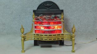 An electric hearth fire in the form of a Regency fire basket with andirons. H.65 W.71 D.30cm