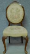 A late 19th century balloon back nursing chair in embroidered upholstery depicting pastoral French