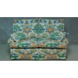 A two seater sofa in polychrome Chinese style upholstery. H.85 W.160 D.90cm