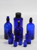 A collection of nine 19th century Bristol blue glass antique pharmacy/chemist bottles and jars. Some