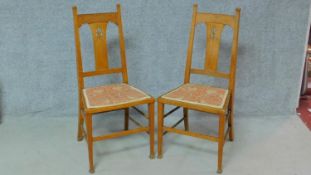 A pair of late 19th century oak Art Nouveau style bedroom chairs. H.102cm
