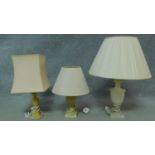 A vintage onyx urn shaped table lamp with shade and two other similar lamps. H.63cm (tallest)