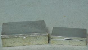 Two cedar lined silver cigarette boxes. One with engine turned decoaration to the top and a linear