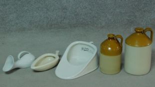 A collection of antique ceramic pieces. Including two glazed stoneware flagons, stamped Liquour