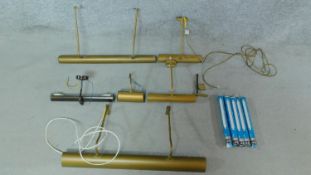 A miscellaneous collection of wall mounted brass picture lights.