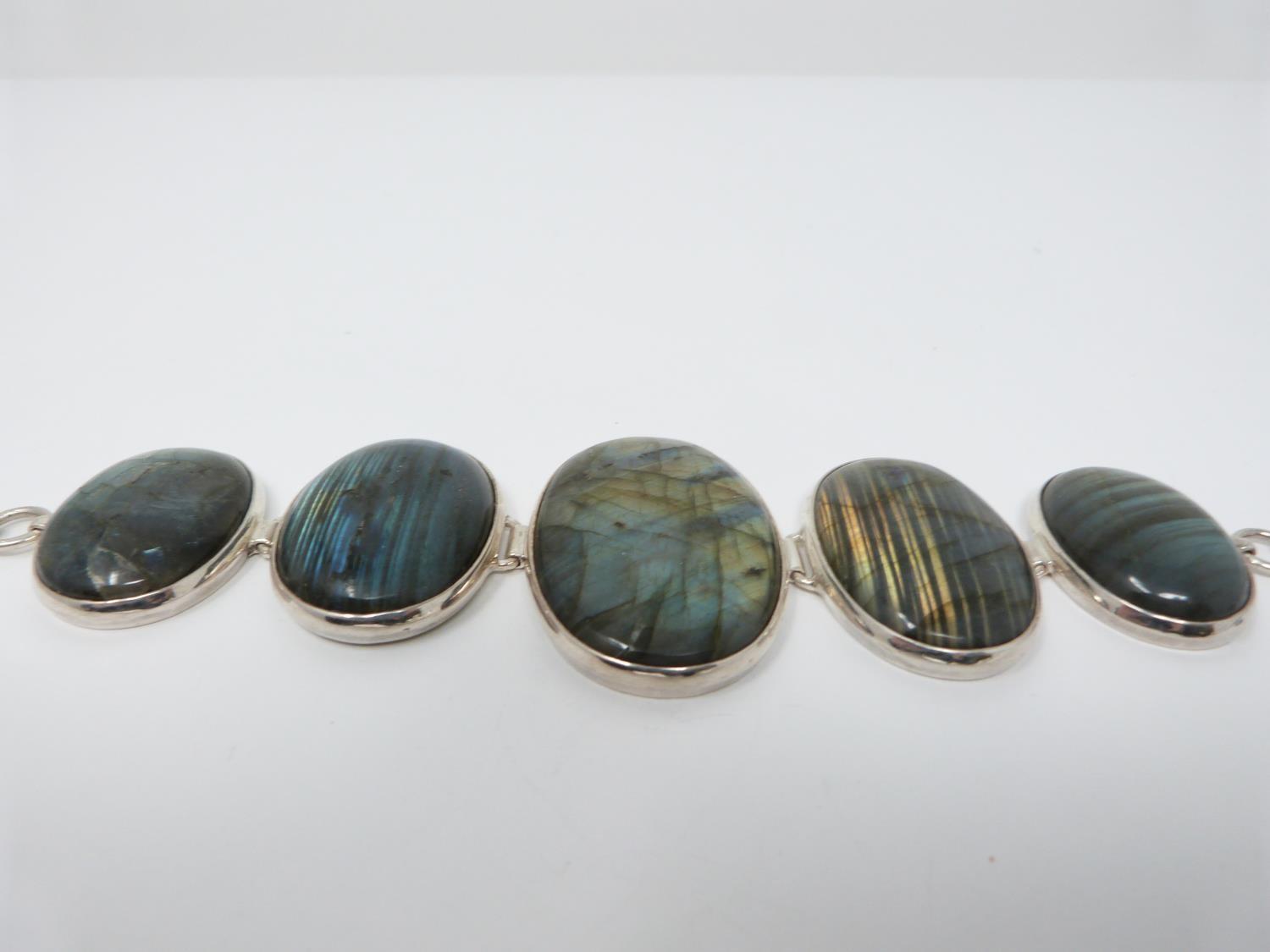 A bespoke silver and Labradorite articulated bracelet, set with five Labradorite cabochons, - Image 5 of 10