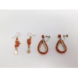 Two pairs of coral drop earrings. One set in gilt metal with a drop shape and coral bead detailing